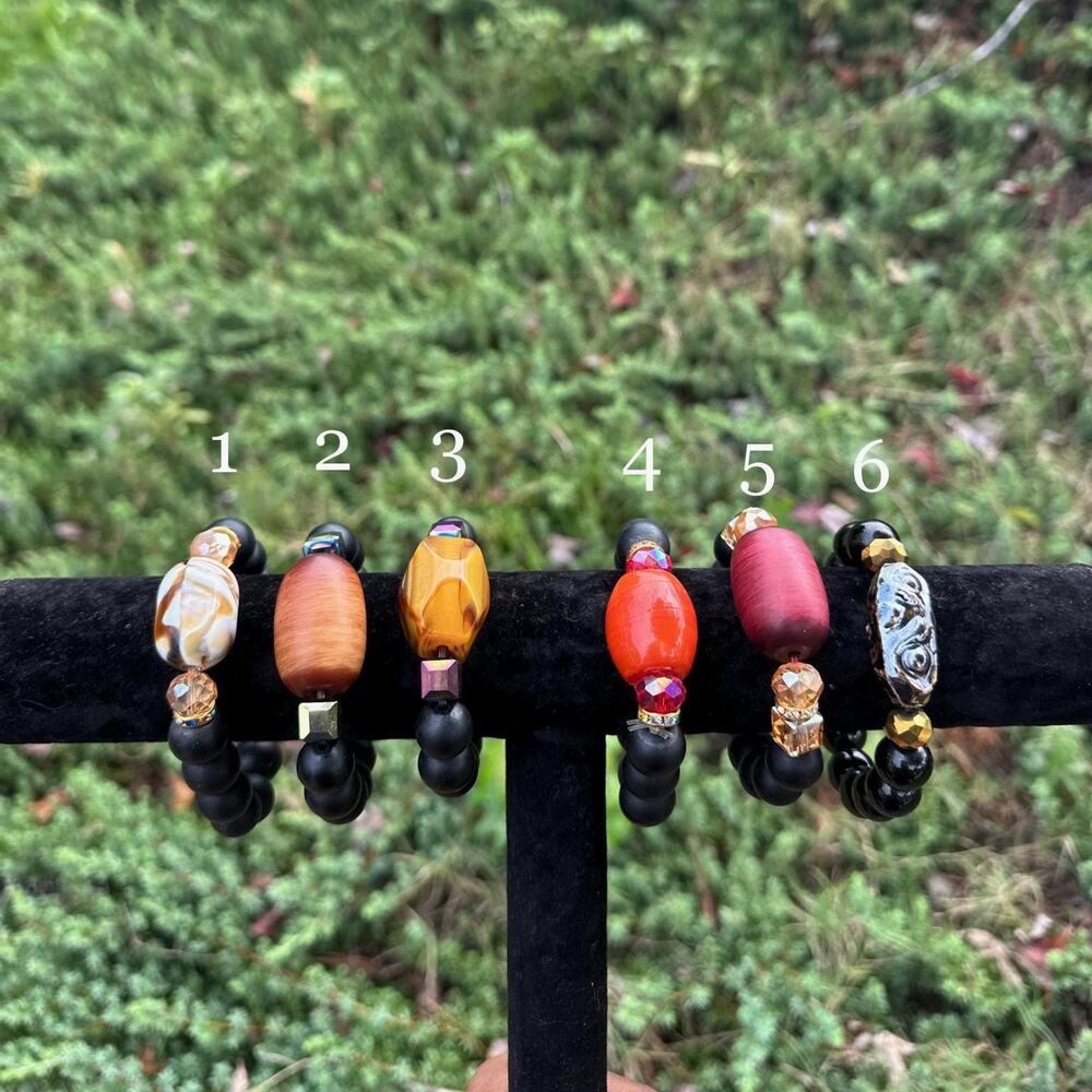 Handcrafted African matte charcoal beaded bracelets with unique accent beads